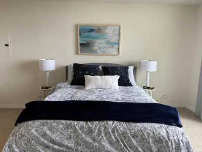 a bedroom with a large bed with two lamps at Luxury Meets Sea of Dreams in Los Angeles