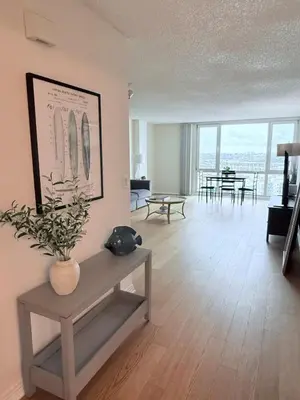 a living room with a vase on a table at Luxury Meets Sea of Dreams in Los Angeles