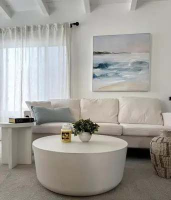 a living room with a white couch and a coffee table at Steps to Sand Cozy 3BR Partial Ocean Views in Manhattan Beach