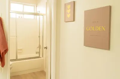 a bathroom with a shower and a sign on the door at Redondo Huge 1Bedroom,3 Queens, close to Beach Sleeps 7 in Redondo Beach