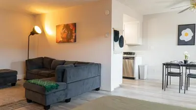 a living room with a couch and a table at Redondo Huge 1Bedroom,3 Queens, close to Beach Sleeps 7 in Redondo Beach