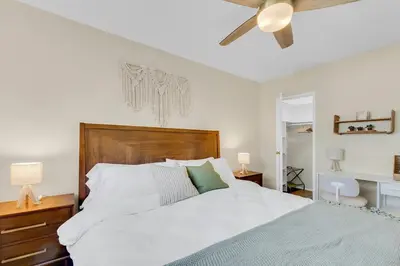 a bedroom with a large bed with a ceiling fan at Beautifully Remodeled 2bed1bath Apartment Top Location 15 min to Beach in Los Angeles