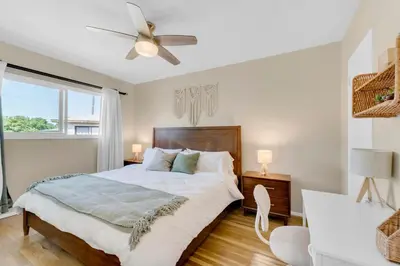 a bedroom with a large bed with a ceiling fan at Beautifully Remodeled 2bed1bath Apartment Top Location 15 min to Beach in Los Angeles