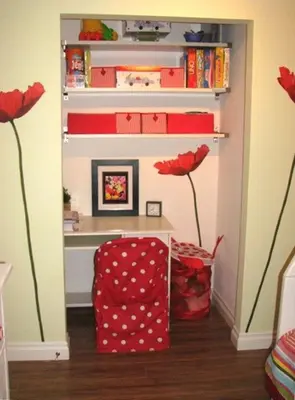 a room with red flowers and a shelf with books at Pixie Hollow by Funtierland Vacation Rentals in Anaheim