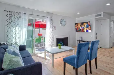 a living room with a couch and a table at New Suite Escapes 5 by Funtierland Vacation Rentals in Anaheim
