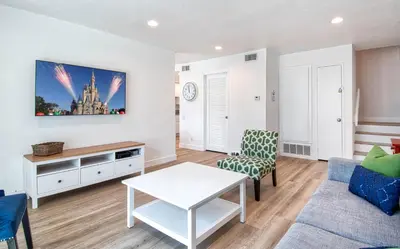 a living room with a couch and a table at New Suite Escapes 6 by Funtierland Vacation Rentals in Anaheim