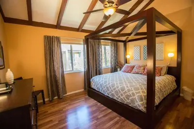 a bedroom with a canopy bed in a room at Bedknobs and Broomsticks by Funtierland Vacation Rentals in Anaheim