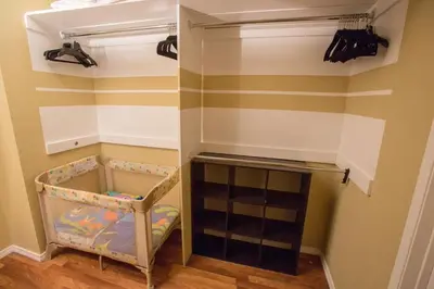 a childs room with a closet with striped walls at Bedknobs and Broomsticks by Funtierland Vacation Rentals in Anaheim