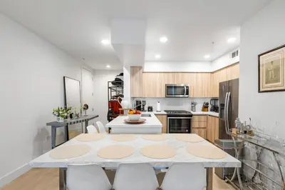 a kitchen and dining room with a table and chairs at Huge Stylish Apartment Santa Mon in Los Angeles