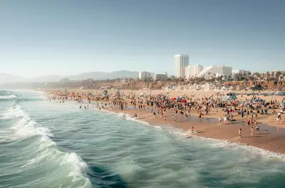 a large group of people on a crowded beach at Huge Stylish Apartment Santa Mon in Los Angeles