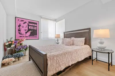 a bedroom with a large bed and a table at Huge Stylish Apartment Santa Mon in Los Angeles