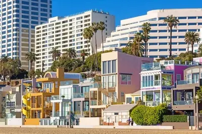 a group of buildings with palm trees and buildings at Huge Stylish Apartment Santa Mon in Los Angeles