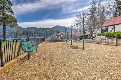 a park with a bench and a swing set at Walk to Lake Arrowhead Village Gem with Lake Access in Lake Arrowhead