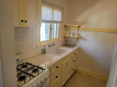 a kitchen with a stove and a sink at Cozy Apartment Two in Hollywood! in Los Angeles