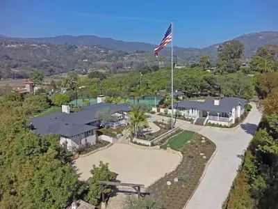 an aerial view of a house with an american flag at Bella Vista by Paradise Retreats in Carpinteria