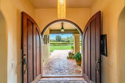 an entrance to a house with an archway at Casa Tranquility by Paradise Retreats in Carpinteria