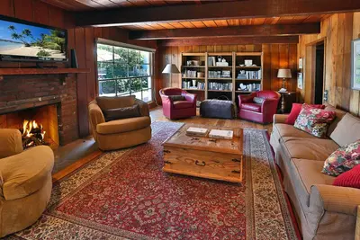 a living room filled with furniture and a fireplace at Rincon Retreat by Paradise Retreats in Carpinteria