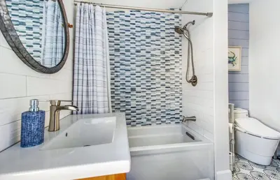 a bathroom with a sink and a shower at Luxury Ocean View Condo Steps To The Sand VIEWS in Manhattan Beach