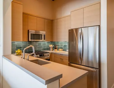 a kitchen with a stainless steel refrigerator at Seahorse Cottage by Paradise Retreats in Carpinteria