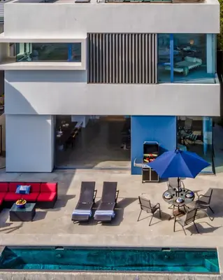 an aerial view of a house with chairs and an umbrella at Seascape by Paradise Retreats in Carpinteria