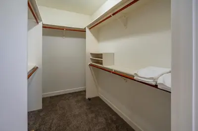 a small closet with white walls and a bed at Summer Sunset by Paradise Retreats in Ventura