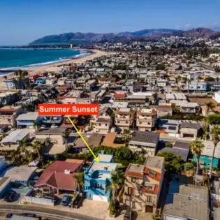 an aerial view of a beach with a red summer sunset sign at Summer Sunset by Paradise Retreats in Ventura