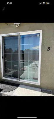 a sliding glass door with a view of an airport at Just The Two Of Us -Romantic Pool View And Private Entry Sleeps 2 Near CSUN CSUN in North Hills