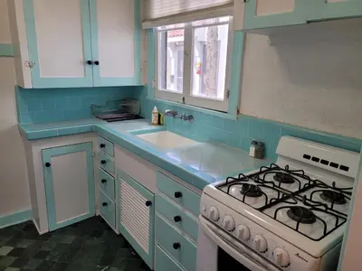 a kitchen with a stove and a sink at Hollywood Bungalow One with Patio! in Los Angeles