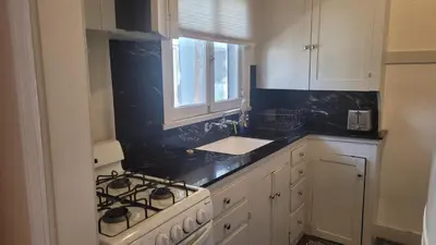 a kitchen with a stove and a sink at Amazing Hollywood Bungalow Three! in Los Angeles