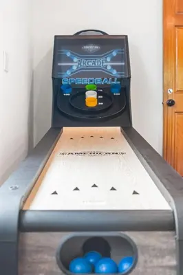 a pinball machine in a room with blue balls at Beverly Hills 6BR Haven w Pool Hot Tub in Los Angeles