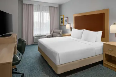 a hotel room with a bed and a television at Homewood Suites by Hilton Anaheim Conv Ctr/Disneyland Main in Anaheim