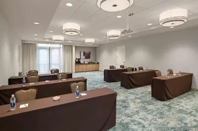 a conference room with tables and chairs in a room at Homewood Suites by Hilton Anaheim Conv Ctr/Disneyland Main in Anaheim