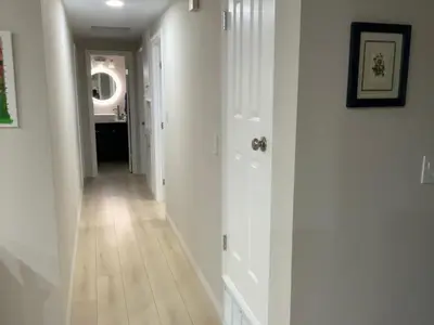 a hallway with white walls and a white floor at 1 bedroom In a quiet neighborhood near the Main Street- Room A in Rowland Heights