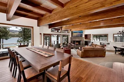 a dining room with a table and a living room at Bear Lake Lodge #2547 in Big Bear Lake