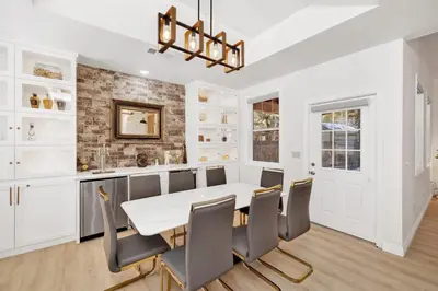a dining room with a white table and chairs at Castlewood Retreat #2524 in Big Bear Lake