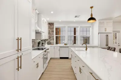 a kitchen with white cabinets and white counter tops at Castlewood Retreat #2524 in Big Bear Lake