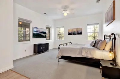 a bedroom with a bed and a ceiling fan at Castlewood Retreat #2524 in Big Bear Lake