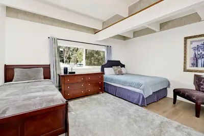 a bedroom with two beds and a window at Suenos Azules #2517 in Fawnskin