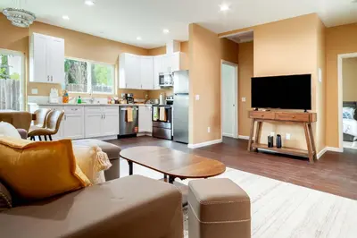 a living room with a couch and a tv at Cozy 2BR Home Mountain Views Pet Friendly in Thousand Oaks