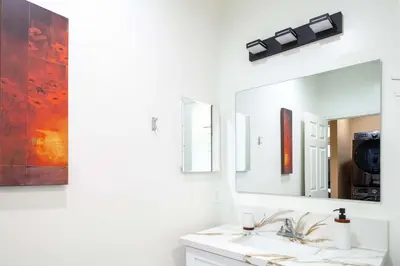a bathroom with a sink and a mirror at Cozy 2BR Home Mountain Views Pet Friendly in Thousand Oaks
