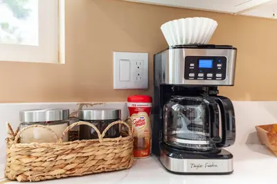 a coffee maker and a basket on a kitchen counter at Cozy 2BR Home Mountain Views Pet Friendly in Thousand Oaks