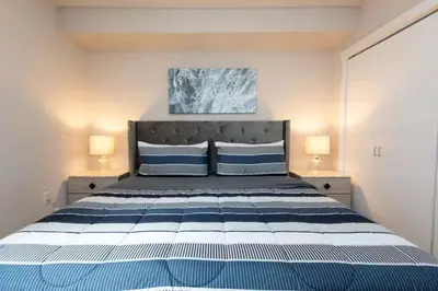 a bedroom with a large bed with two pillows at Downtown Los Angeles Gem 2 in Los Angeles