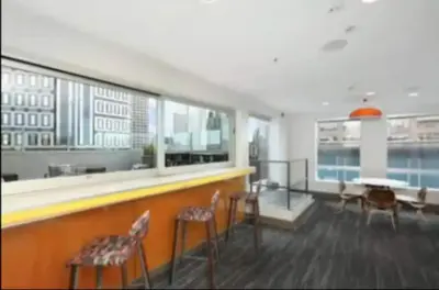 a room with a bar with chairs and a table at Downtown Los Angeles Gem 2 in Los Angeles