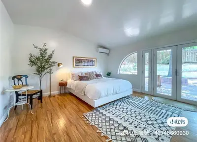 a bedroom with a bed and a large window at Hillside-This is a House with 5 master suite in Riverside