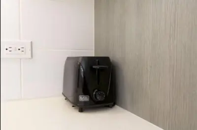 a black television sitting on a counter in a room at Hosp Walk to Santa Monica Beach Pier in Los Angeles