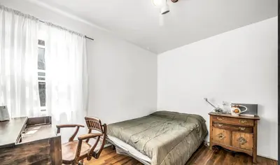 a bedroom with a bed and a desk and a table at Venice Beach Boho - 2 apartments in Los Angeles