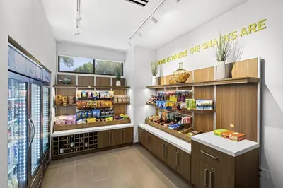 a grocery store aisle with a lot of products at Home2 Suites By Hilton Riverside Downtown in Riverside