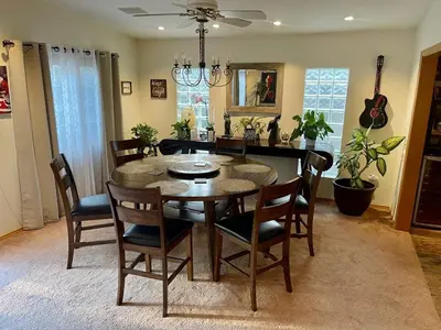 a dining room with a table and chairs at Cheerful Single Story 3-bedroom home w pool table in Santa Clarita