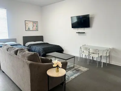 a living room with a couch and a table at The NoHo Artist Nook in Burbank