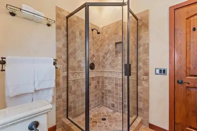 a shower with a glass door in a bathroom at Blue Ocean View Retreat - Minutes to Beach in Summerland